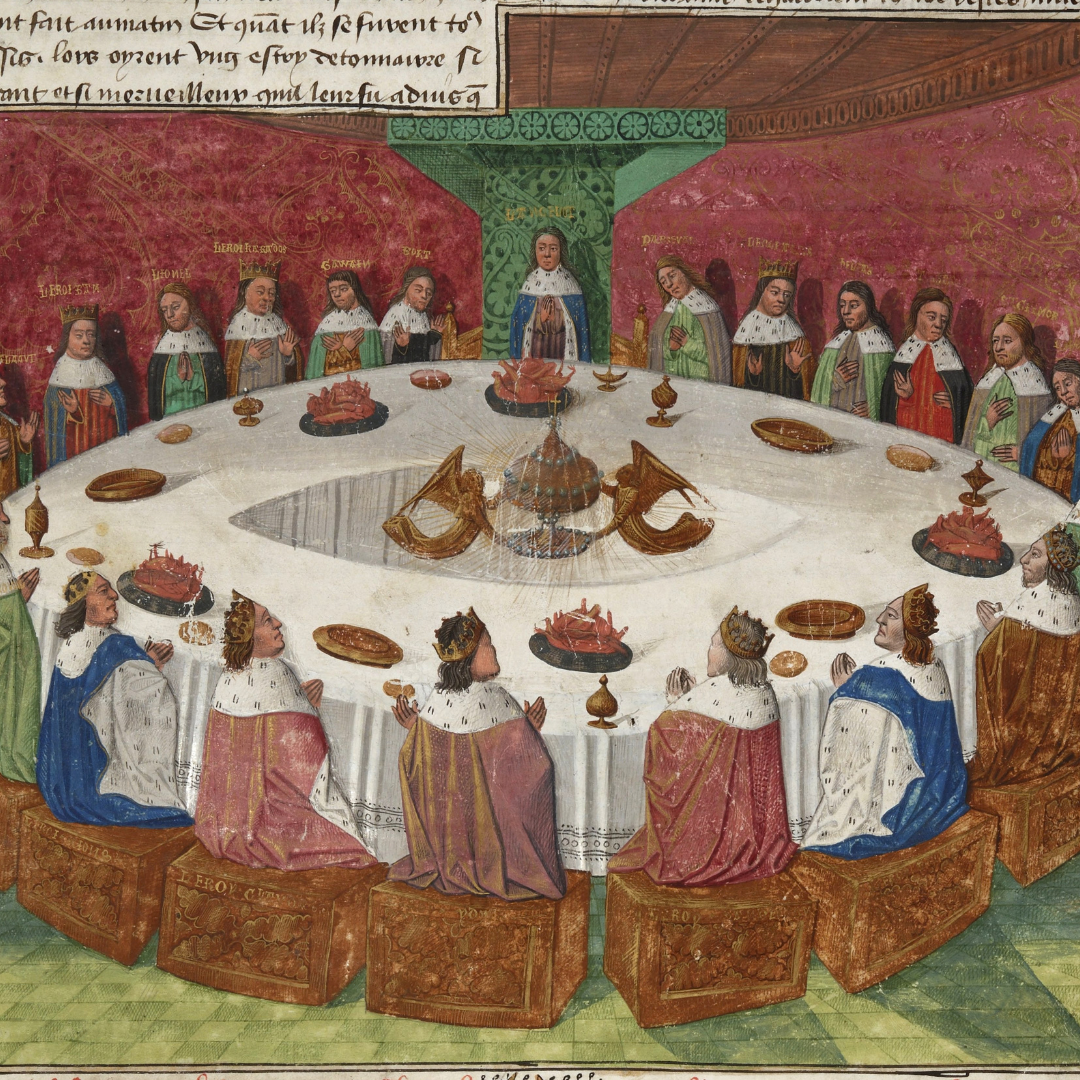 King Arthur sitting at the round table with his knights.